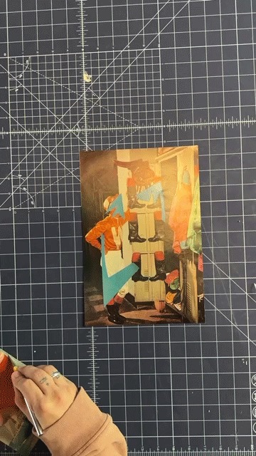Mario's hands assembling a physical collage