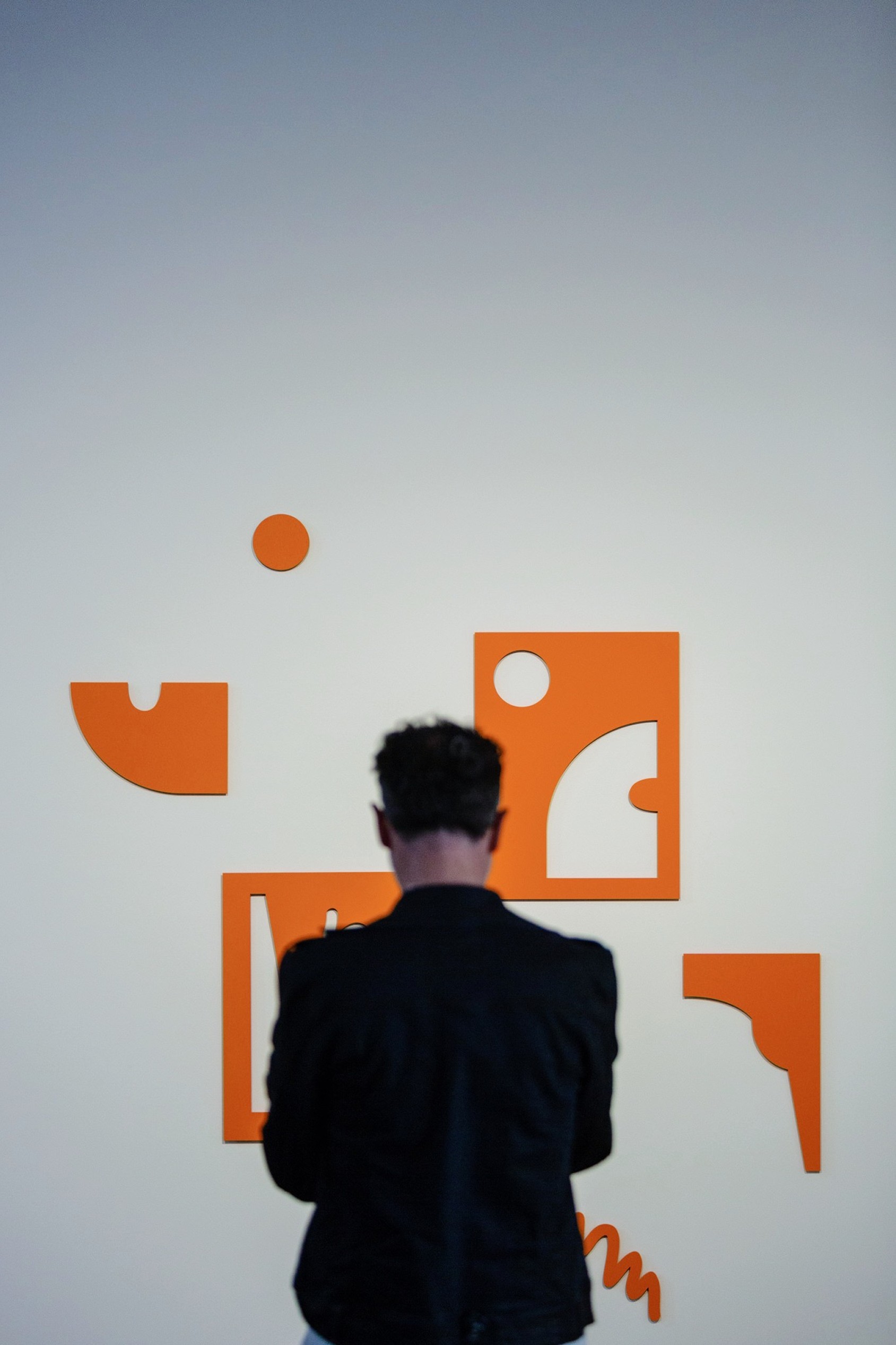 Tangerine Dreams environmental wall graphics — cut orange shapes